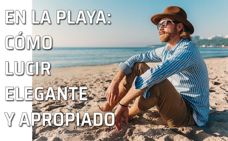 Joven elegante contempla el mar desde la playa