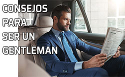 Hombre elegante lee el periódico en su coche